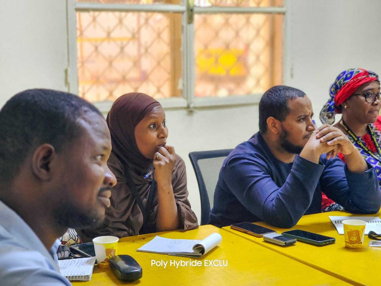 Adult learners in discussion during an English training session at D.A Language Academy